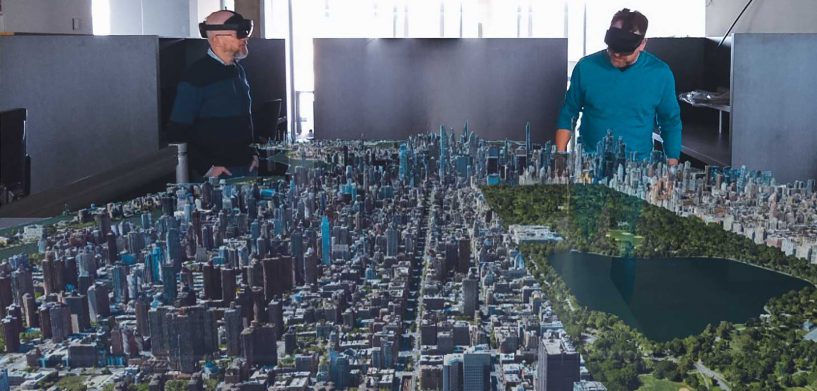 Technologists wearing VR headsets view Smart Digital Reality in their office