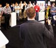 man demonstrating Leica AP20 Pole to crowd at The Zone at HxGN LIVE Global 2022